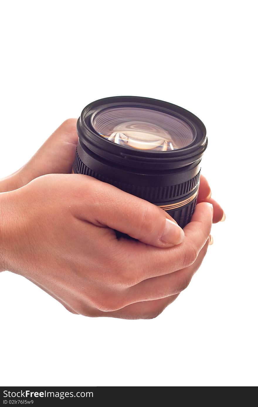 Photo lens in woman's hands. Isolated on white background