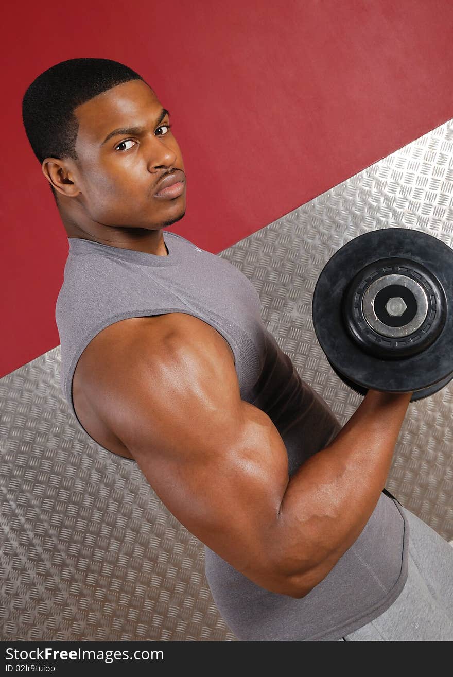 This is an image of a man lifting weights. This is an image of a man lifting weights.