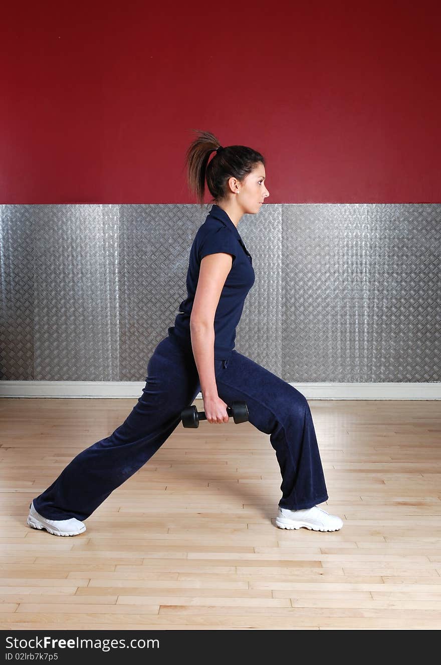 This is an image of woman in the gym. This is an image of woman in the gym