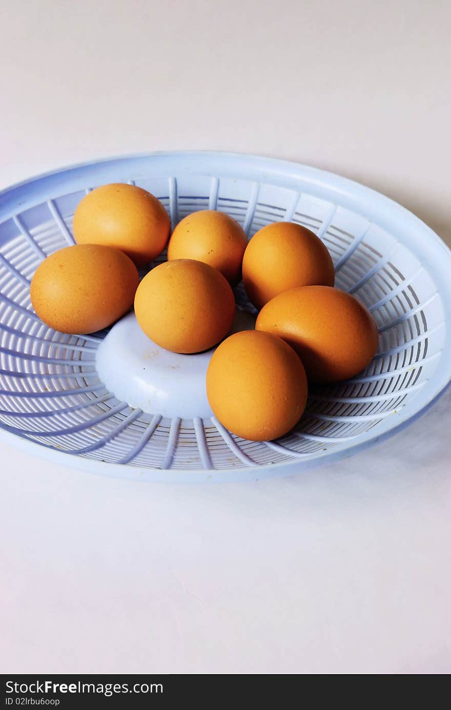 Fresh eggs on a white background