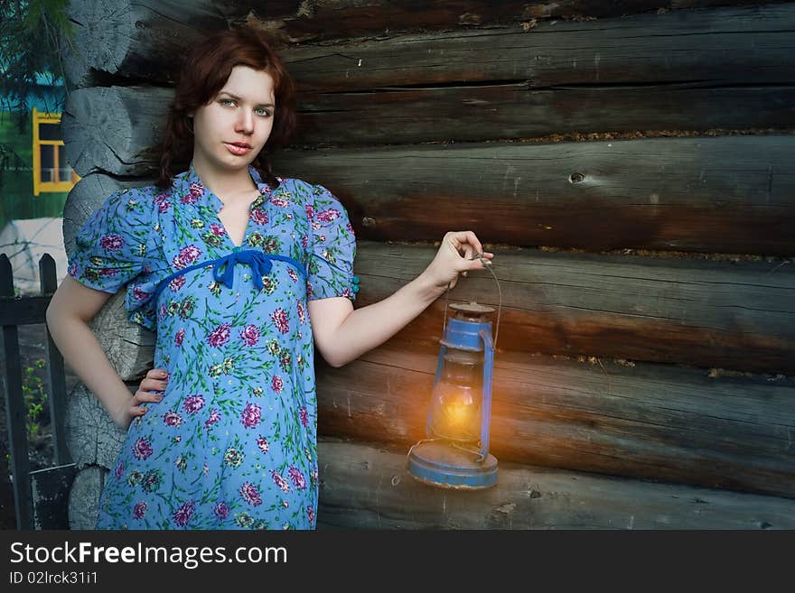 Beauty woman in vintage dress on wooden background