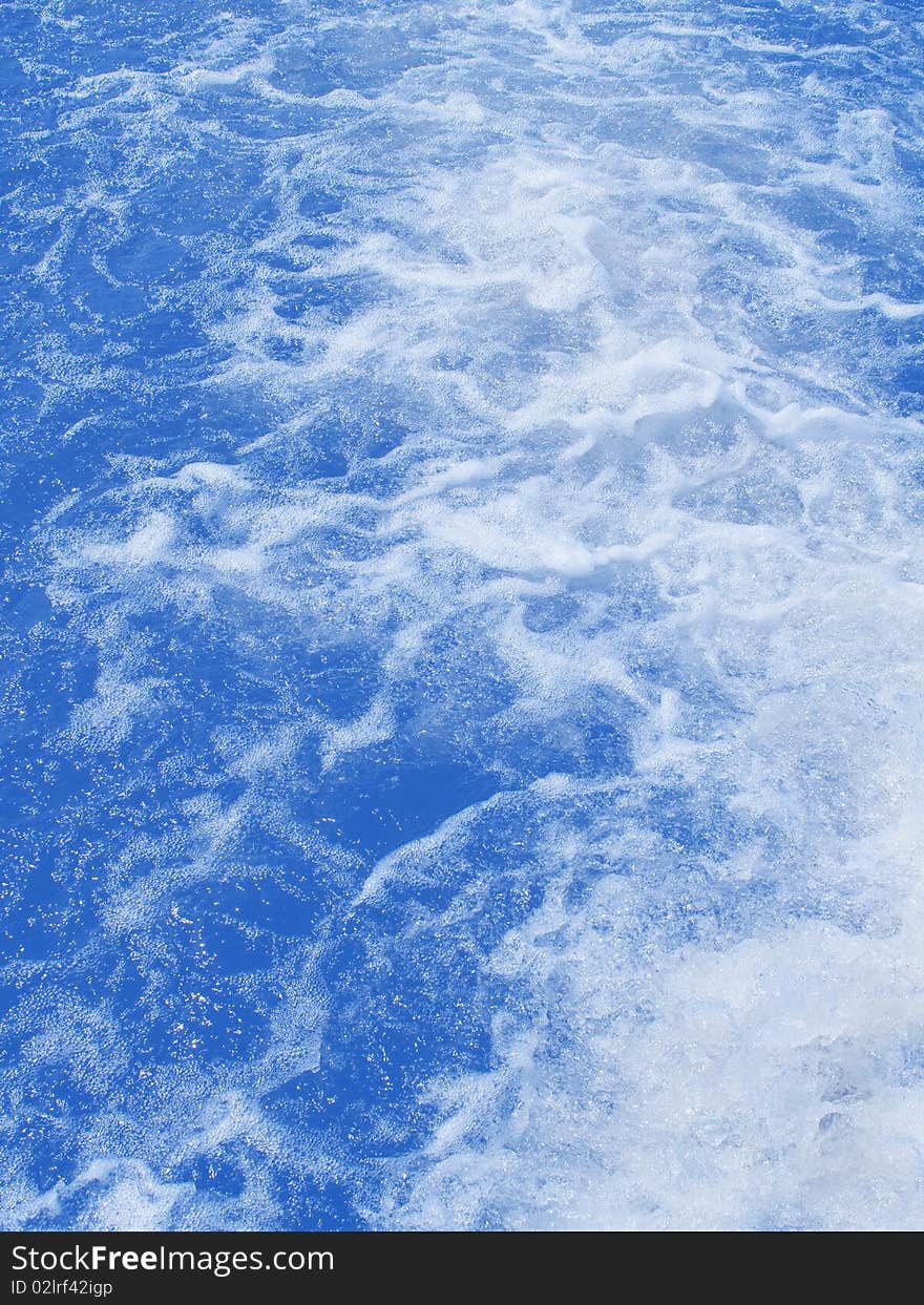 Waves on sea water from a floating vessel. Waves on sea water from a floating vessel