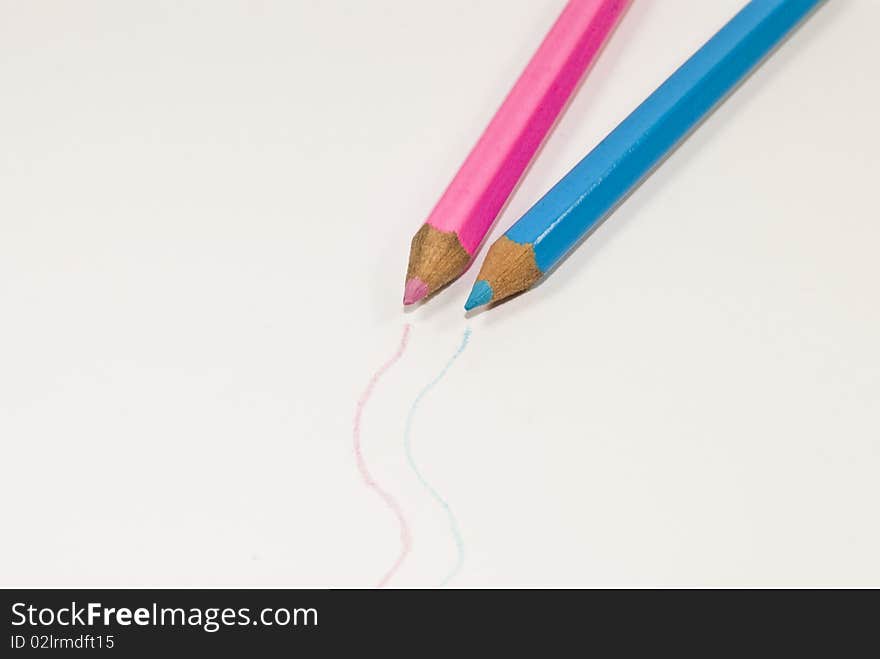 Two pens with different colors on gray background