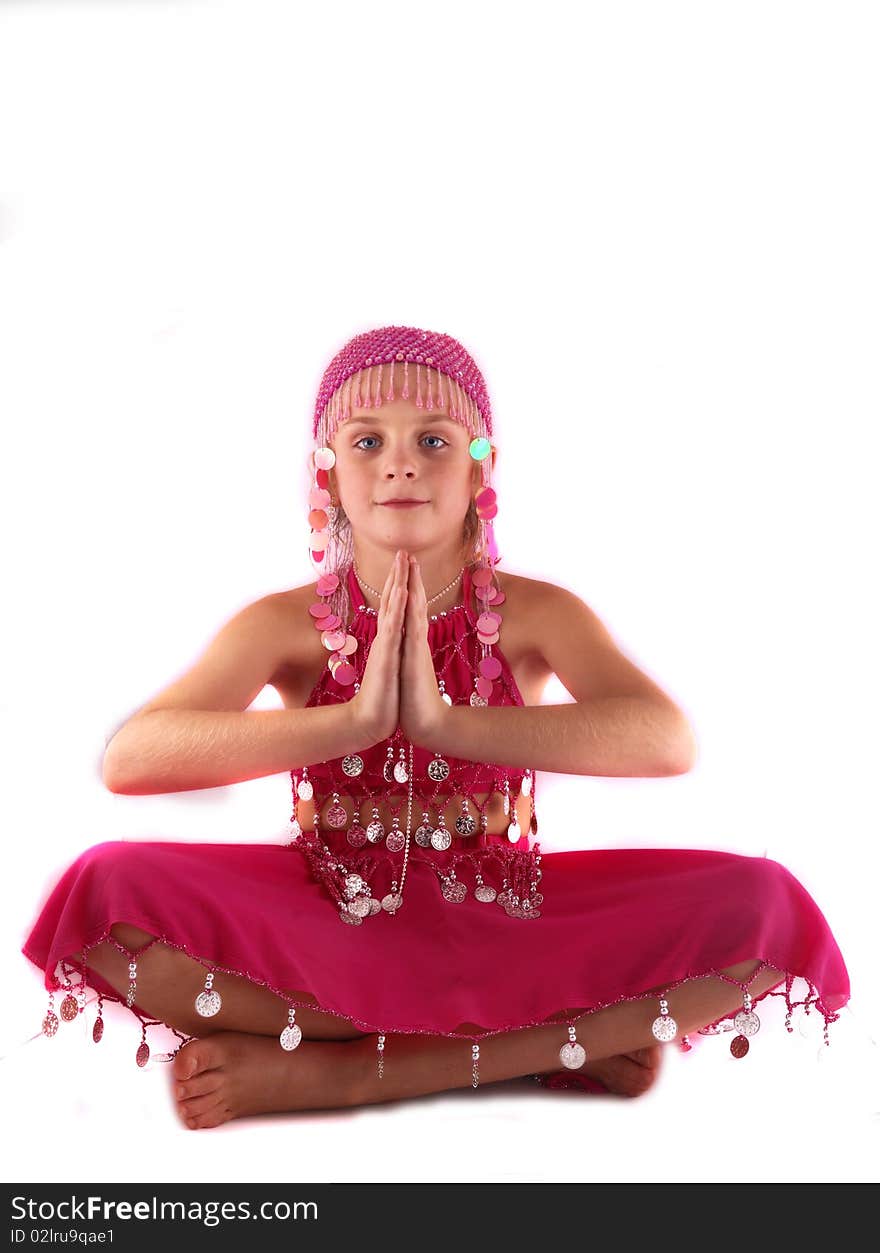 The young girl in an Oriental dress with metal ornaments