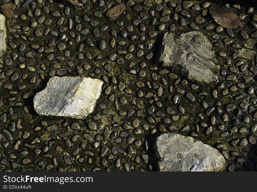 Decorative river stone embedded on the drainage lining structure