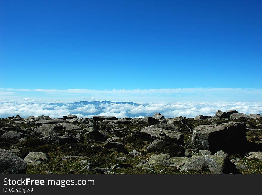 Mountains in the sea of clouds with blue sky in the morning