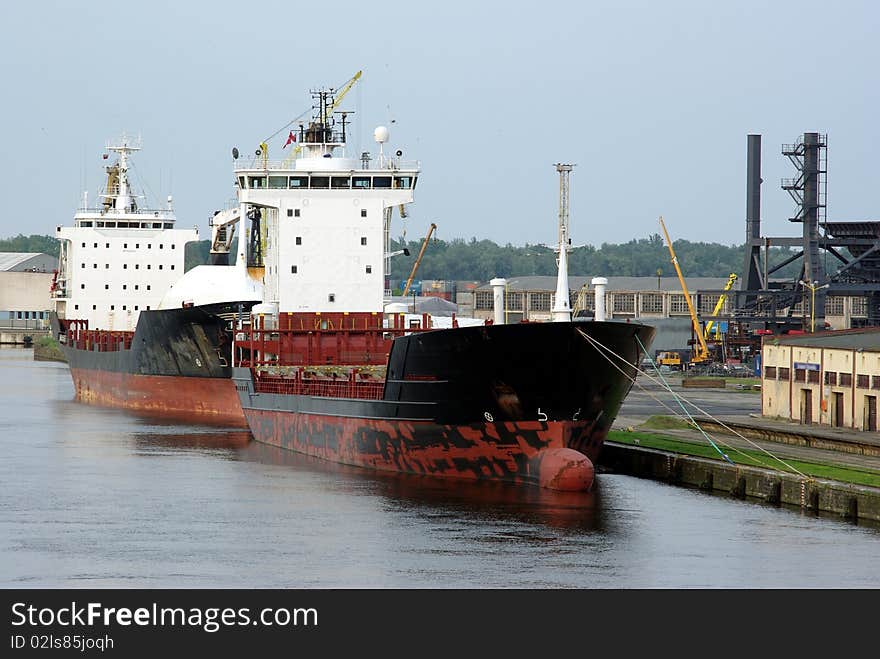 Two ships moored near embankment