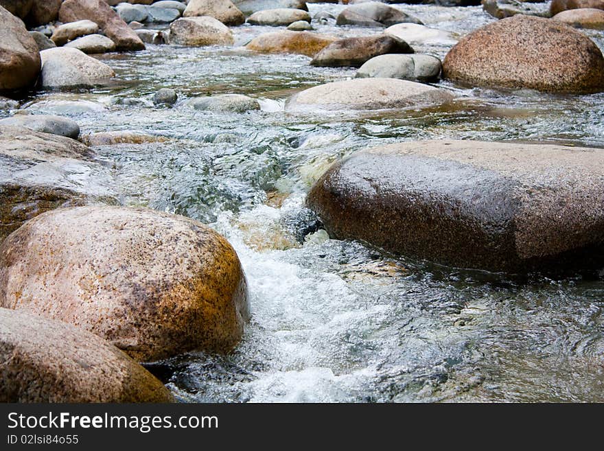 Stones in the water on the river.