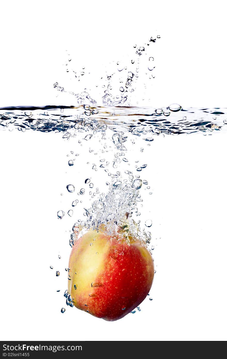 Red apple splashing into water isolated on white background. Red apple splashing into water isolated on white background