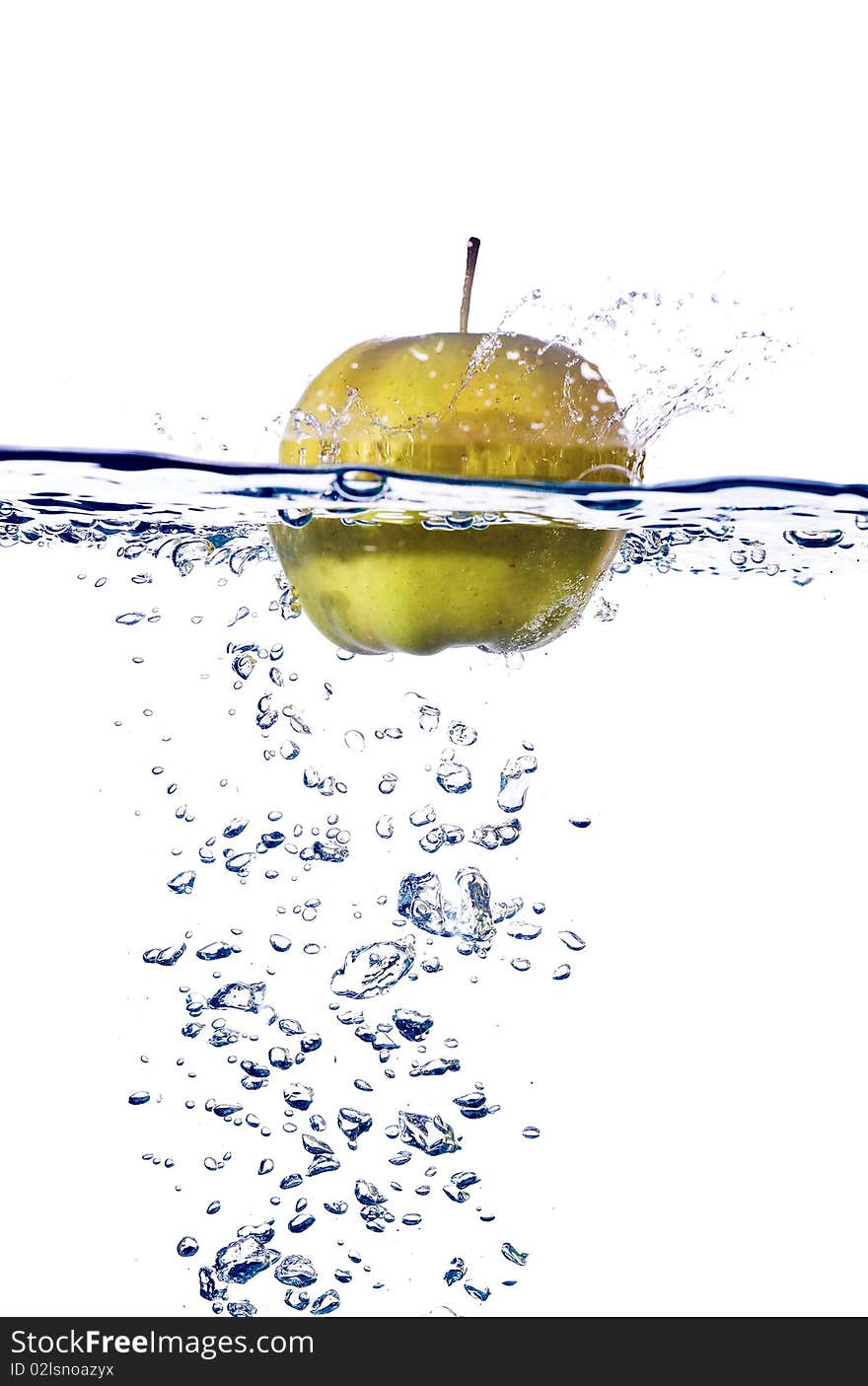 Green apple splashing into water isolated on white background. Green apple splashing into water isolated on white background