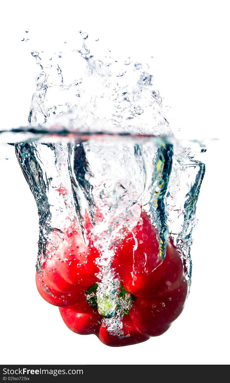 Water splash on red pepper isolated on white. Water splash on red pepper isolated on white