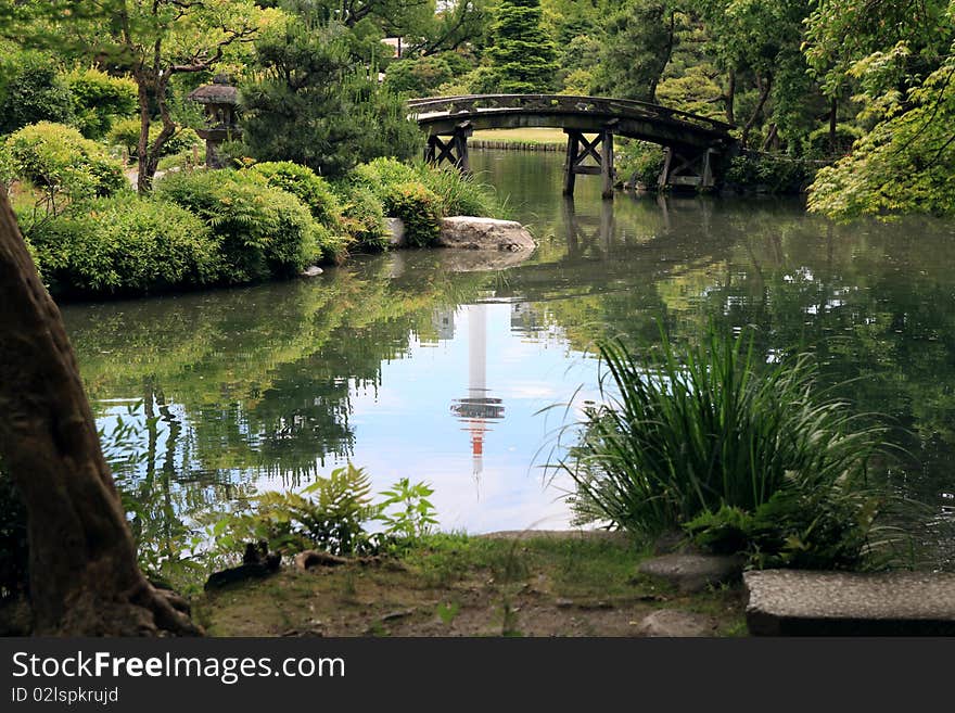 Modern tower reflected in the water