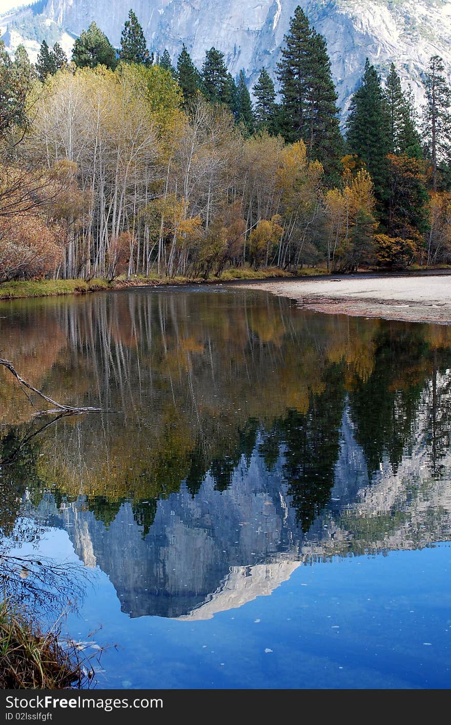 Half Dome reflected in a slow moving river in Yosemite, California