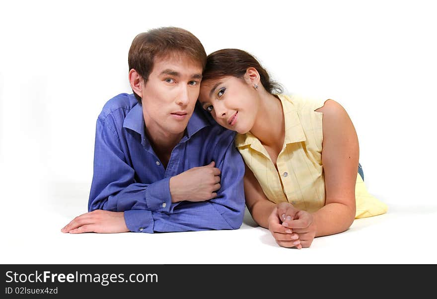 Young loving couple over white