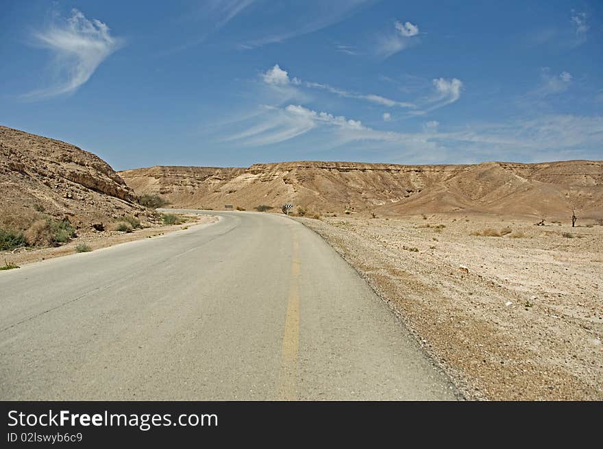 Narrow, old and rarely used road in the Arava desert. Narrow, old and rarely used road in the Arava desert