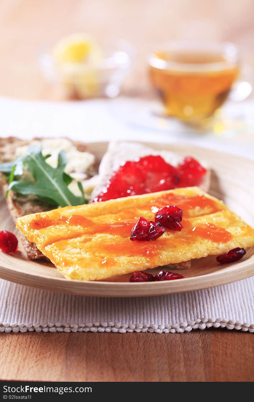 Various types of crispbread and jam - closeup