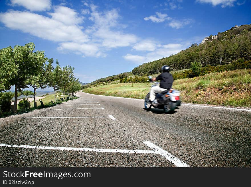 Motorist on the road with mountain scenery. Motorist on the road with mountain scenery