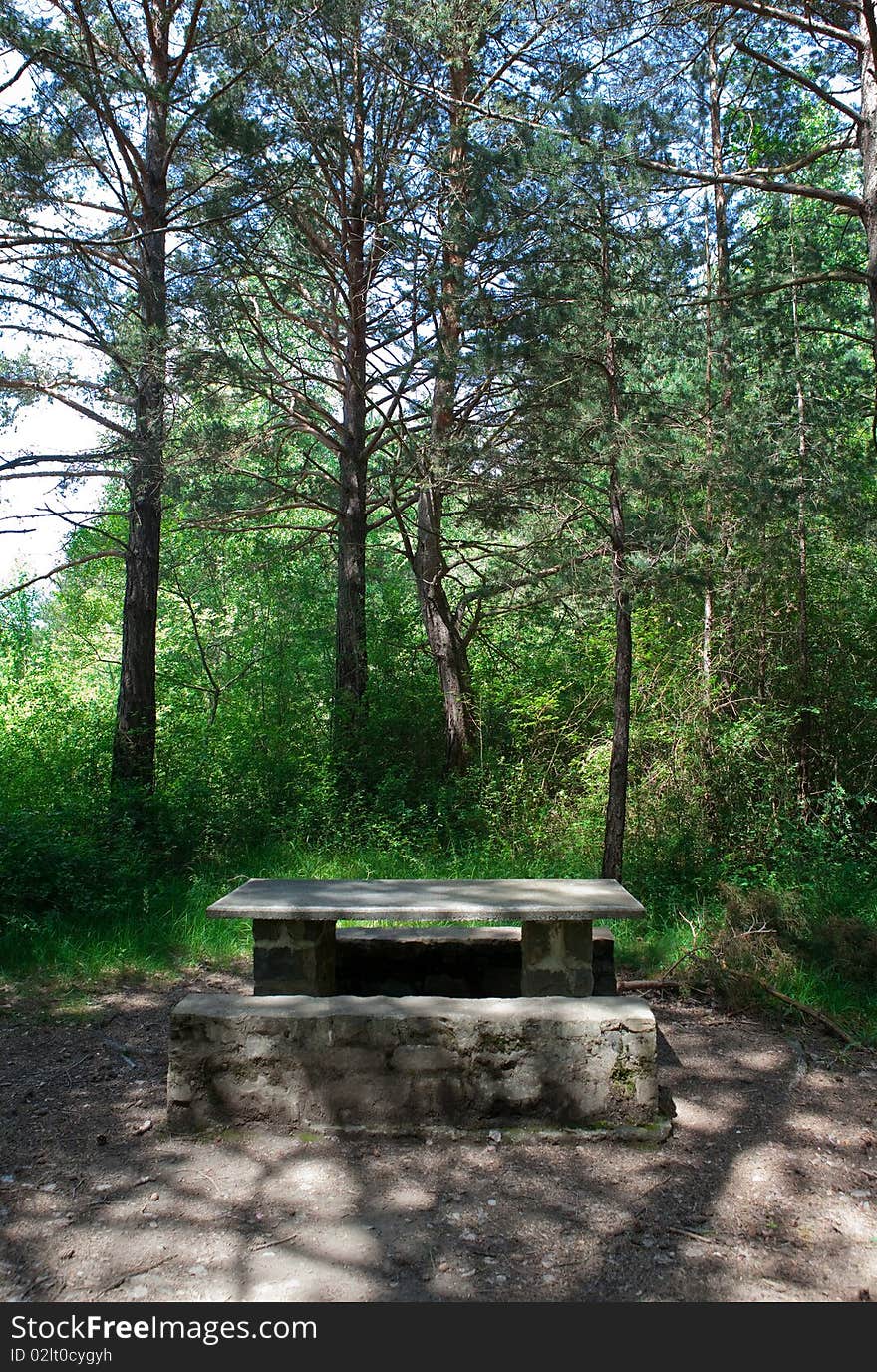 Picnic table among the trees of the forest. Picnic table among the trees of the forest