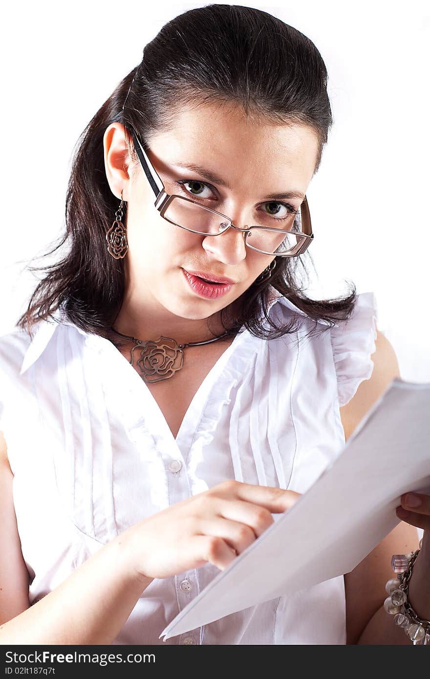 Girl holding papers and pointing in them. Girl holding papers and pointing in them