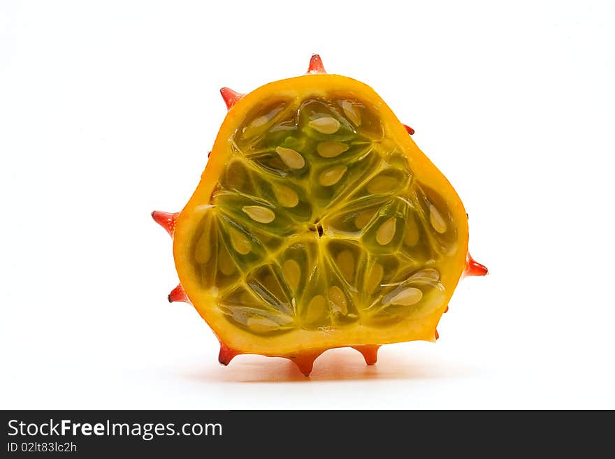 Horned melon, also known as Blowfish Fruit, cut away showing inside seeds and pulp on a white background. Horned melon, also known as Blowfish Fruit, cut away showing inside seeds and pulp on a white background.