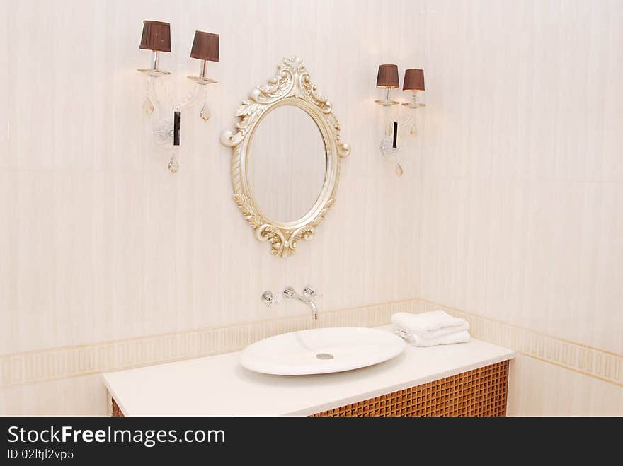 It is interior of apartment, it is a basin in the bathroom