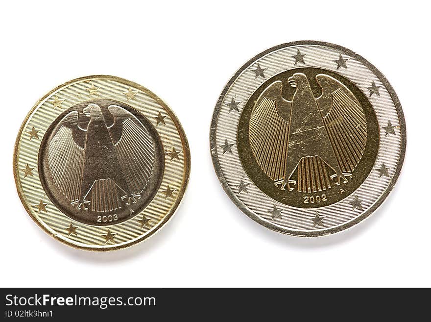 Back of two and one dollor euro coins isolate on white background