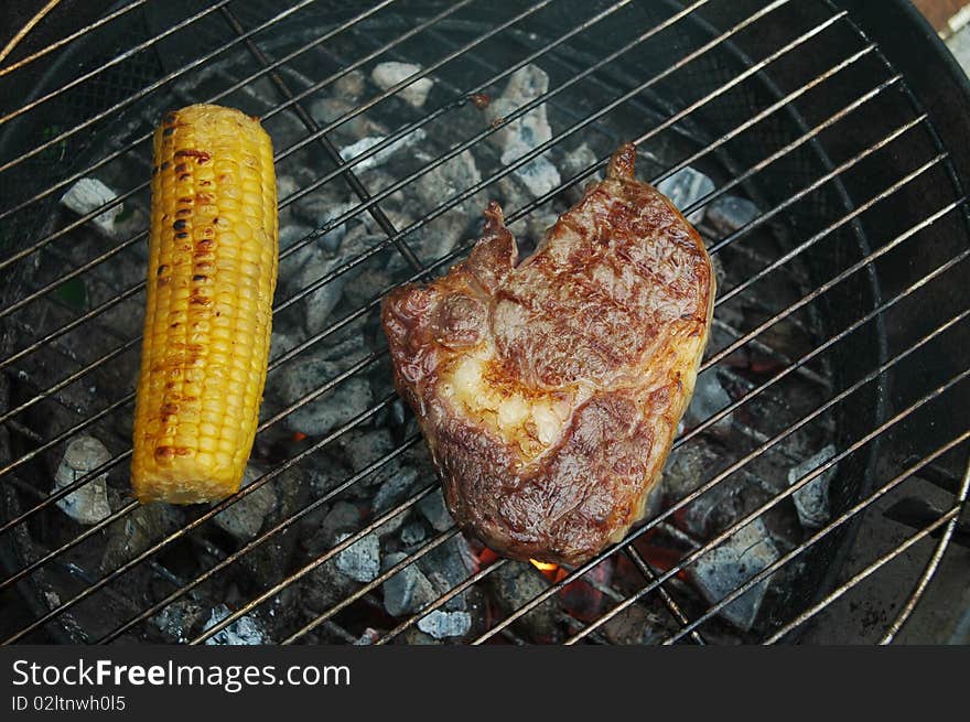 Ribeye steak on a charcoal grill