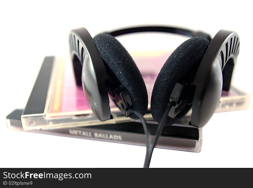 Headphones and compact disks on white background. Headphones and compact disks on white background