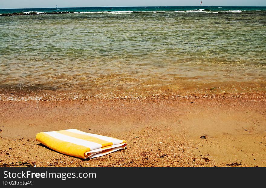 Turquoise sea and towel.