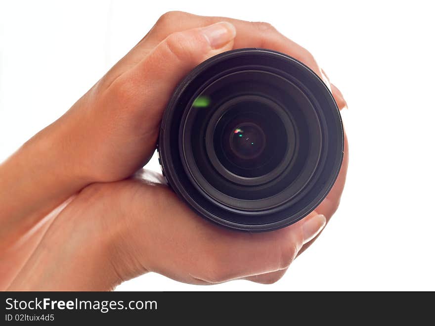 Photo lens in woman's hands. Isolated on white background. Photo lens in woman's hands. Isolated on white background