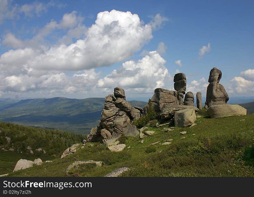 The Altay mountainous landscape with granite rocks against the blue sky. The Altay mountainous landscape with granite rocks against the blue sky