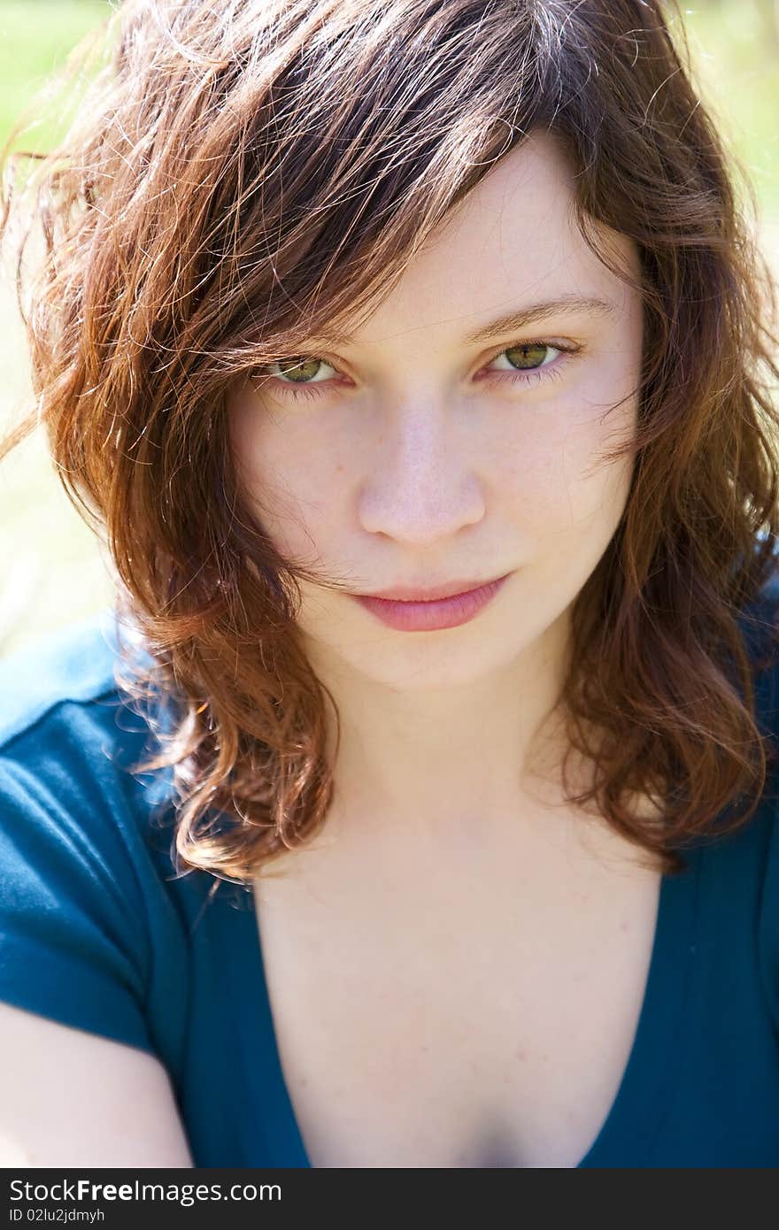 Attractive young woman portrait under the sunlight. Attractive young woman portrait under the sunlight