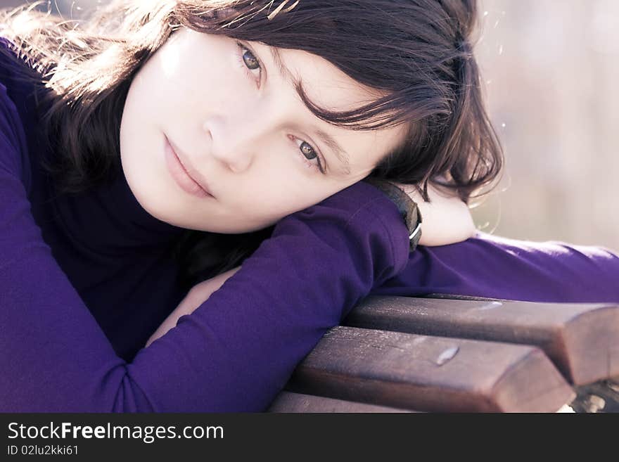 Close portrait of good looking woman in bench. Close portrait of good looking woman in bench