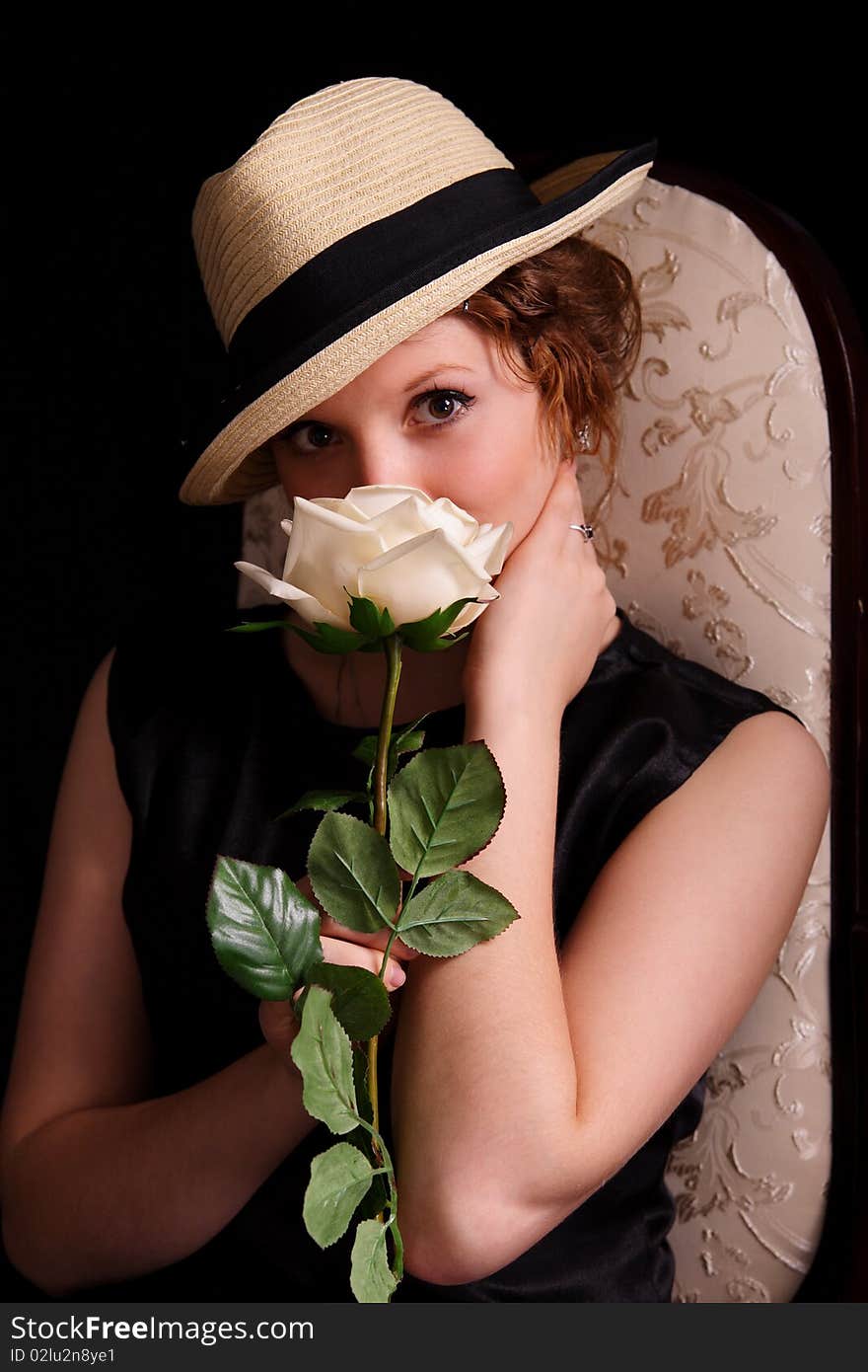 Portrait of the beautiful young woman with a rose. Portrait of the beautiful young woman with a rose