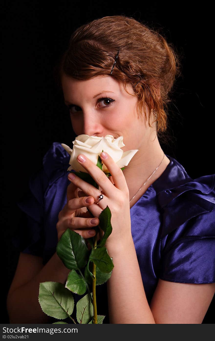 Portrait of the beautiful young woman with a white rose. Portrait of the beautiful young woman with a white rose