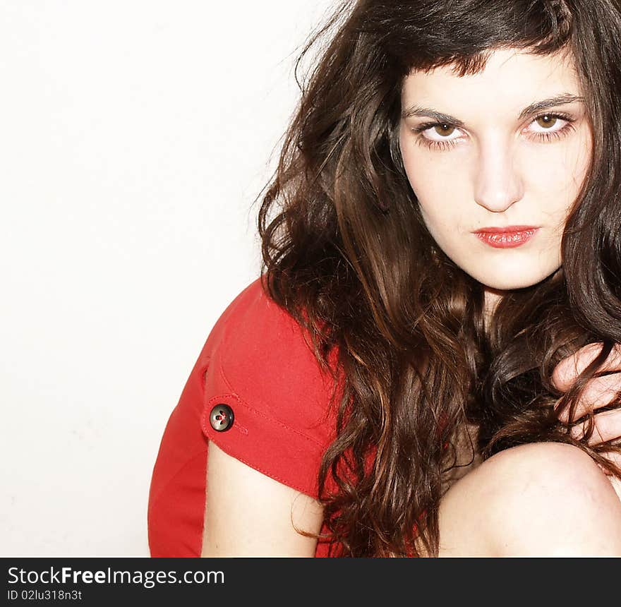 Young woman in red dress posing