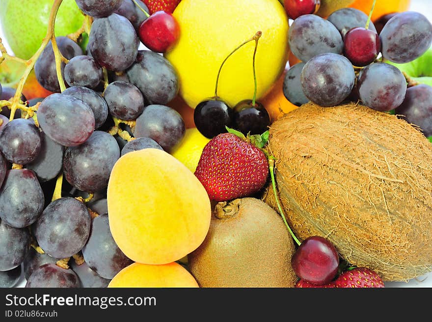 Background of bright exotic fruit and berries. Background of bright exotic fruit and berries