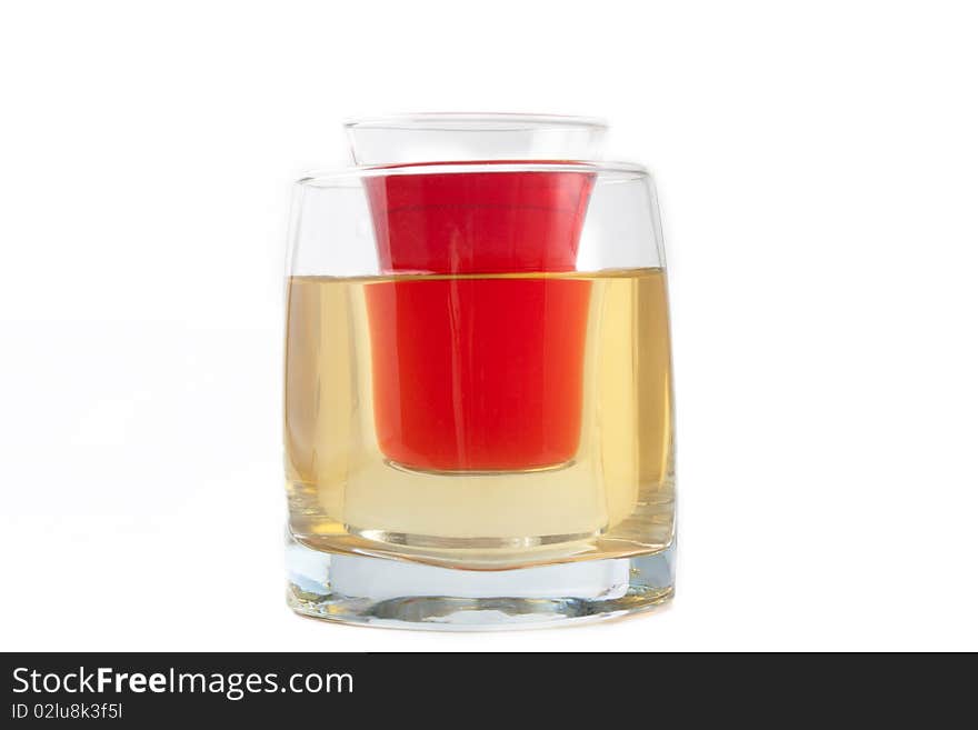 Glass in the glass with a drink on a white background