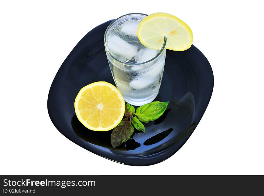 Isolated glass of lemon water. Isolated glass of lemon water