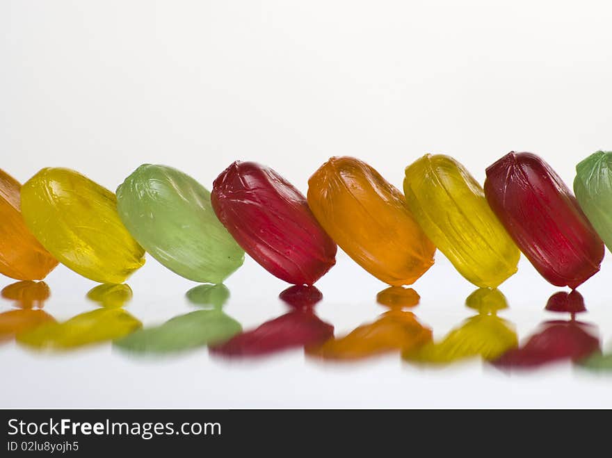 Row of bonbons with reflection