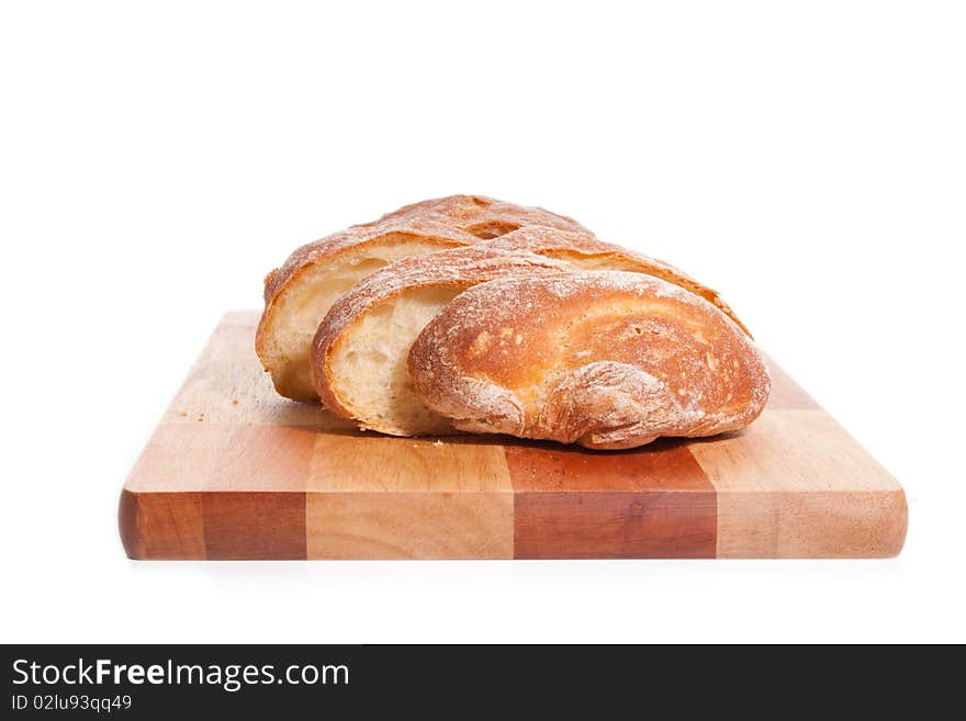 Bread on a cutting board on a white background (bread on a cutting board)