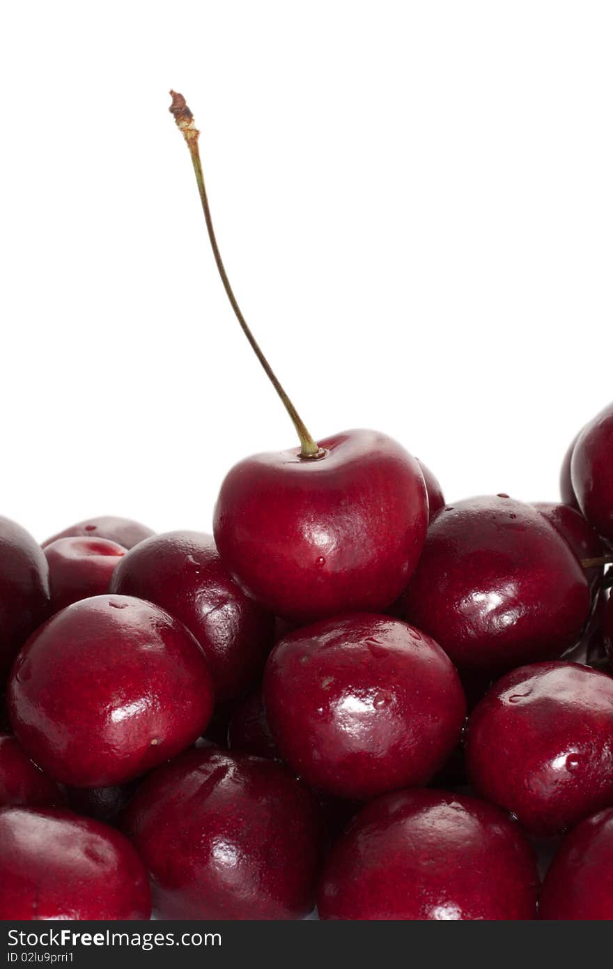 Group cherry with water droplets on a white background (selective focus)