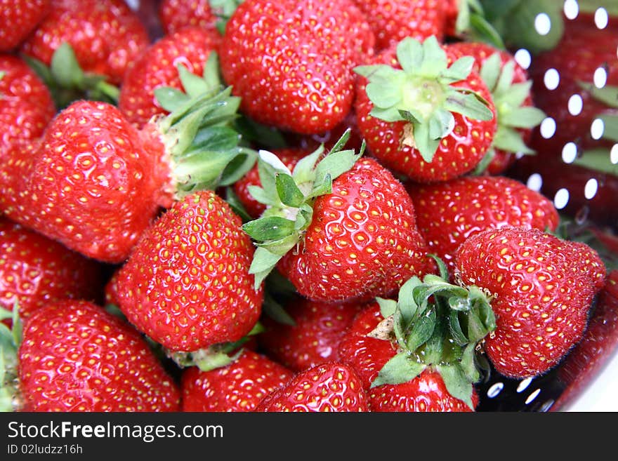 Some strawberries in a colander