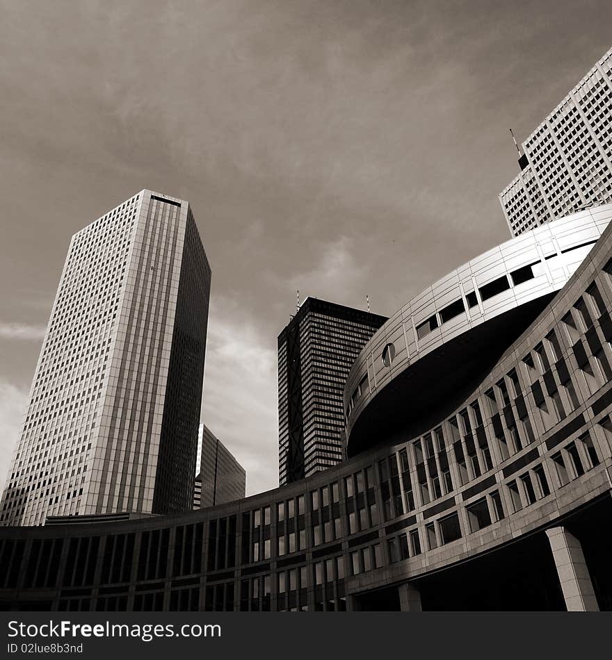 Some of the high-rises in West Shinjuku. The lower building is part of Tokyo Metropolitan government. Some of the high-rises in West Shinjuku. The lower building is part of Tokyo Metropolitan government.