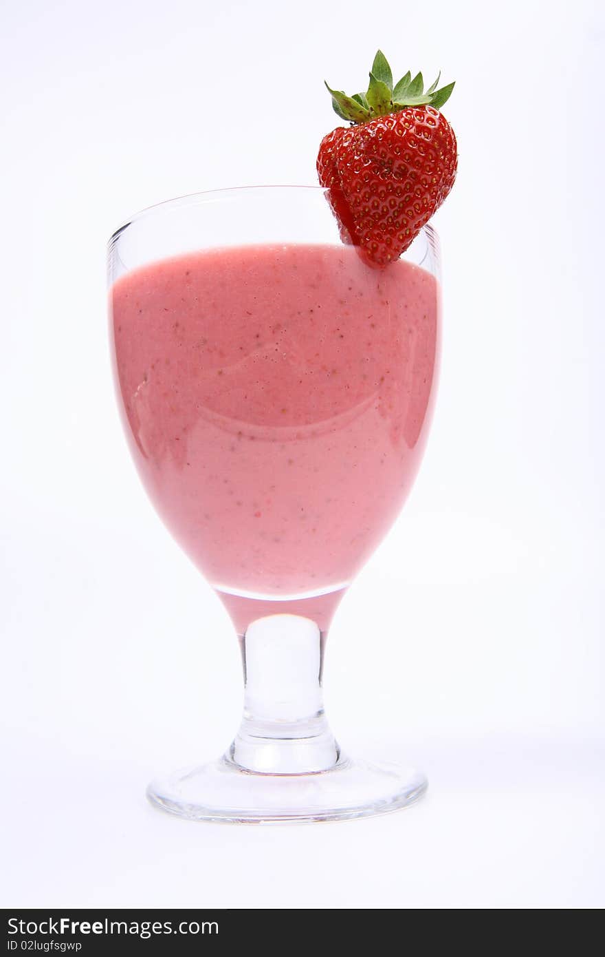 Strawberry shake in a glass decorated with a strawberry on white background