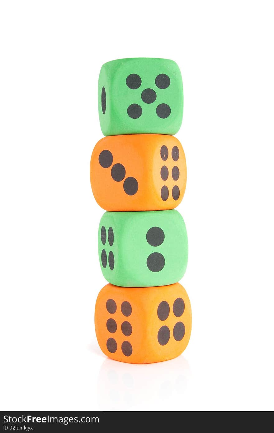 Four colorful stacked green and orange dice isolated over white. Four colorful stacked green and orange dice isolated over white