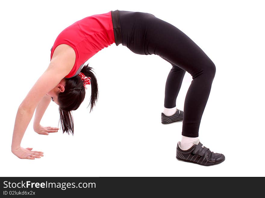 Pretty young girl in the gymnastic pose