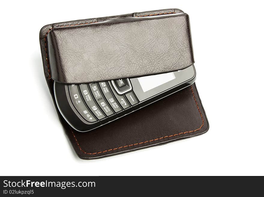 Cell phone in leather case isolated on white. Cell phone in leather case isolated on white