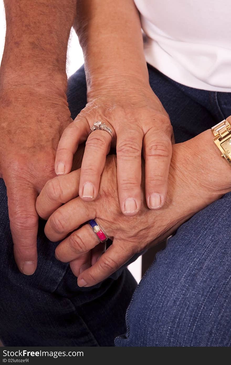 Elderly couple hands, together. Showing both hands and all its wrinkles. Elderly couple hands, together. Showing both hands and all its wrinkles