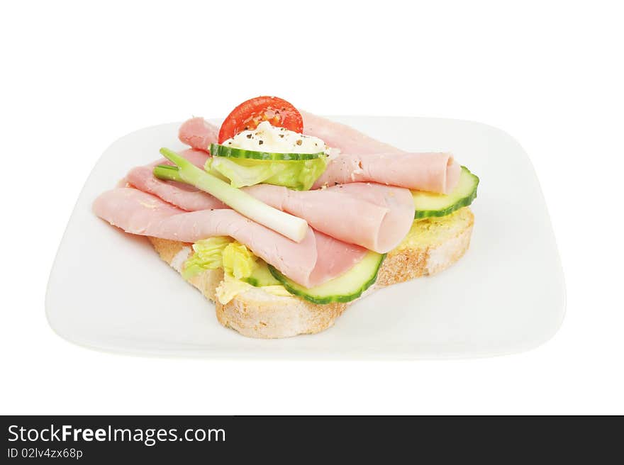 Open ham and salad ham sandwich on a plate. Open ham and salad ham sandwich on a plate